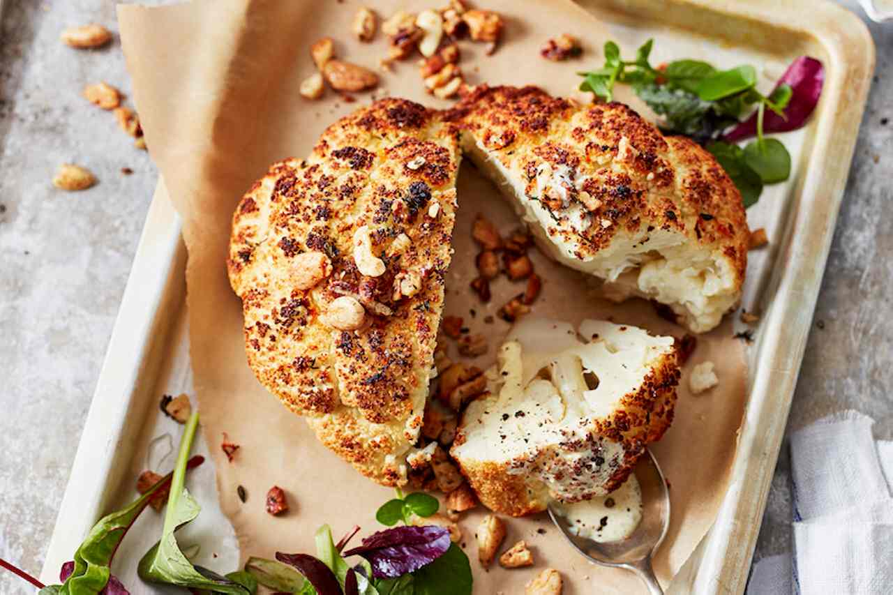 Easy and spectacular baked cauliflower with wild herb salad