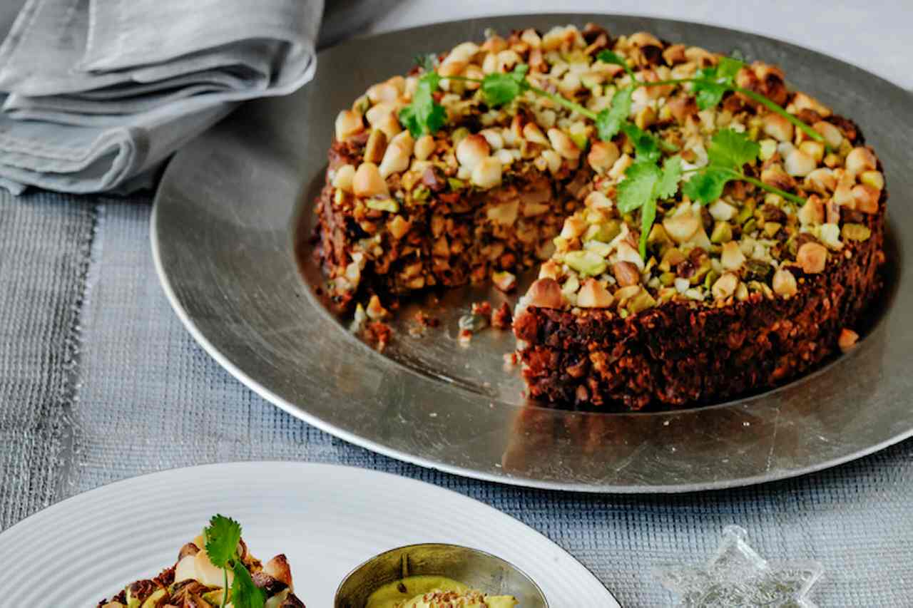 Macadamia and pistachio nut roast with spiced yoghurt sauce