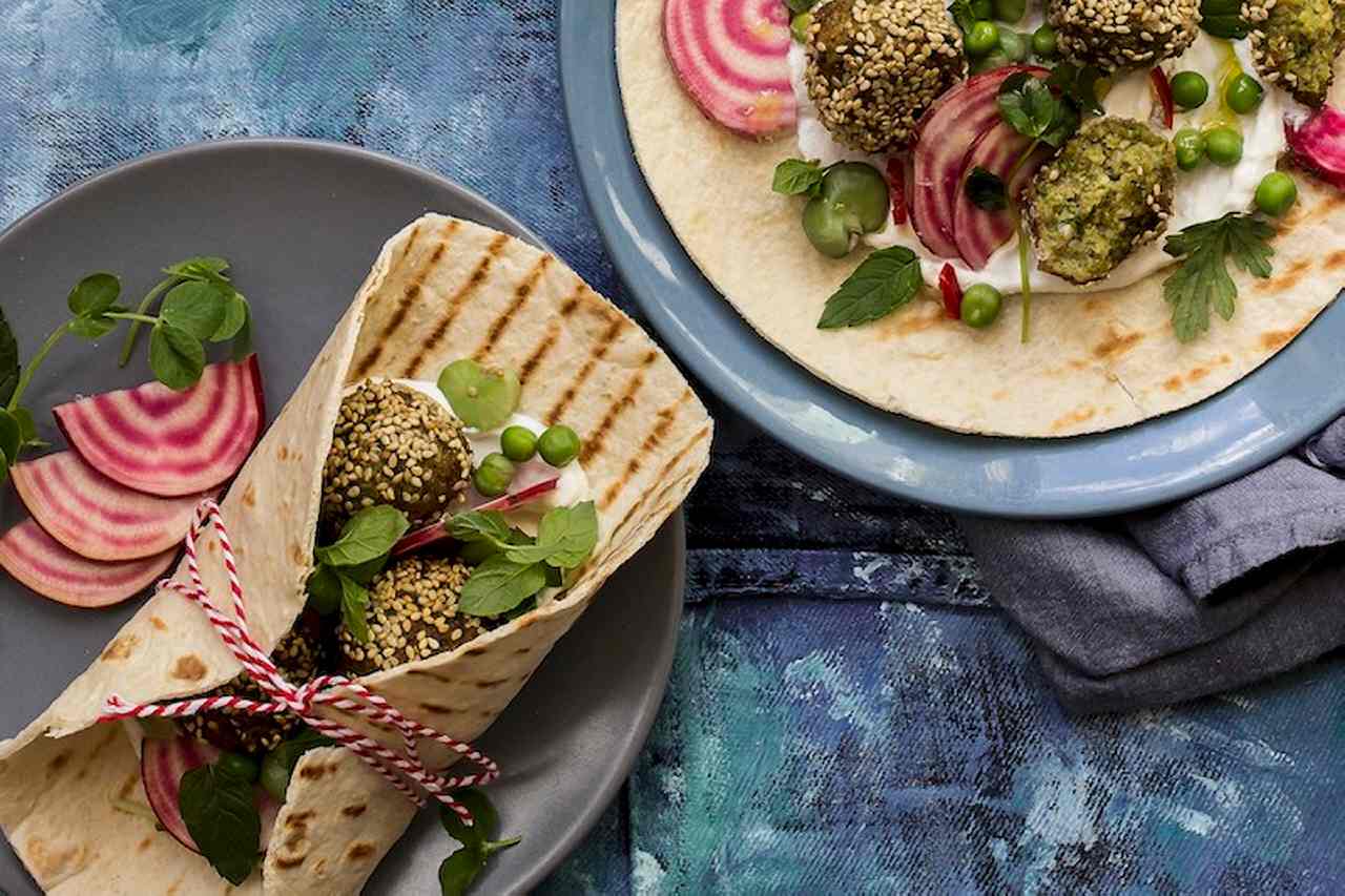 Selfmade wraps with broad bean and sesame falafel